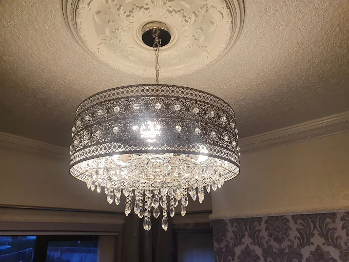Chandelier light fitting installation by electrician in Hull